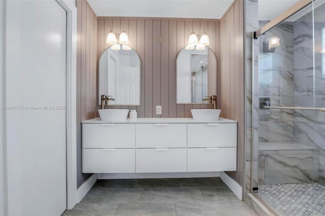 18501 NW 19th St, Pembroke Pines, FL 33029 - bathroom with double vanity, a marble finish shower, baseboards, and wood walls