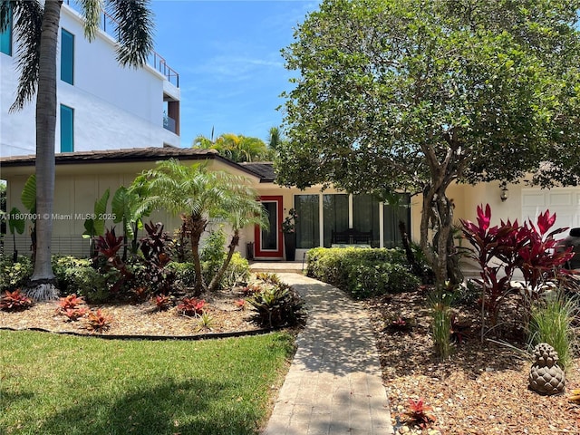 13105 Coronado Dr, North Miami, FL 33181 - view of front of property featuring stucco siding and a garage