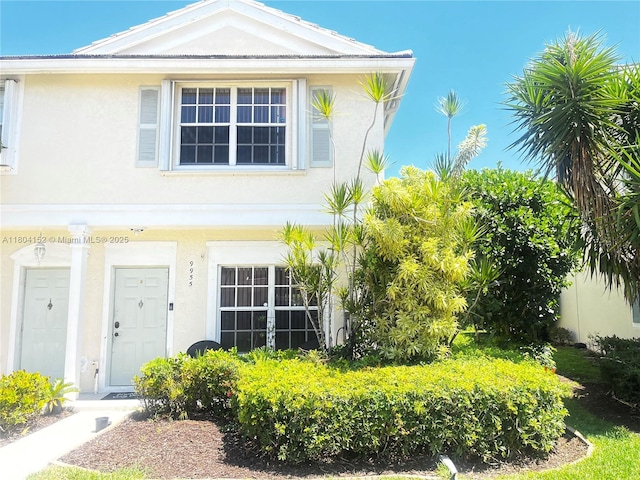 9955 NW 56th Pl, Coral Springs, FL 33076 - view of front of home with stucco siding