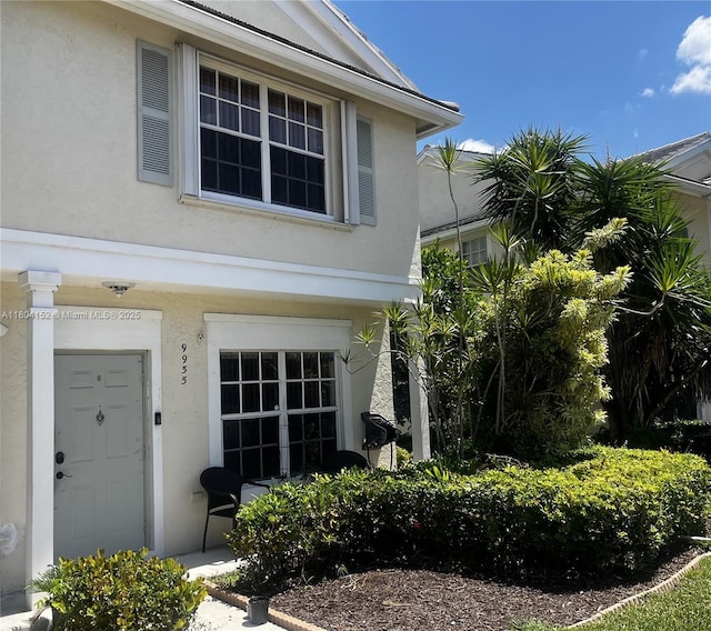9955 NW 56th Pl, Coral Springs, FL 33076 - property entrance featuring stucco siding