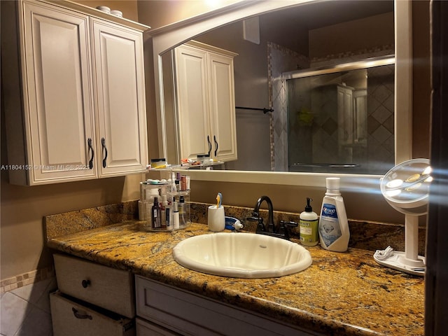 9955 NW 56th Pl, Coral Springs, FL 33076 - bathroom featuring vanity, a shower stall, and tile patterned floors
