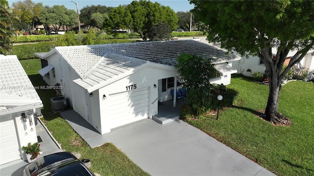 1175 NW 90th Way, Plantation, FL 33322 - exterior space featuring an attached garage, concrete driveway, a front lawn, a tiled roof, and cooling unit