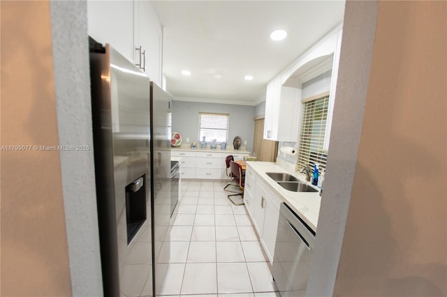 1175 NW 90th Way, Plantation, FL 33322 - kitchen with a sink, stainless steel appliances, crown molding, light countertops, and white cabinetry