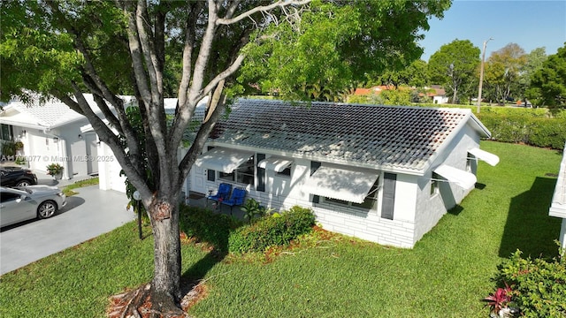 1175 NW 90th Way, Plantation, FL 33322 - view of property exterior featuring a lawn and concrete driveway