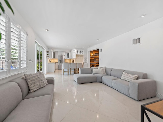 5930 SW 13th Ter, West Miami, FL 33144 - living room with light tile patterned floors and recessed lighting