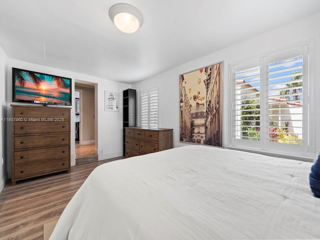 5930 SW 13th Ter, West Miami, FL 33144 - bedroom featuring wood finished floors and baseboards