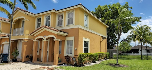 10846 SW 240th Ln, Homestead, FL 33032 - view of front of property with a tiled roof, stucco siding, and a balcony