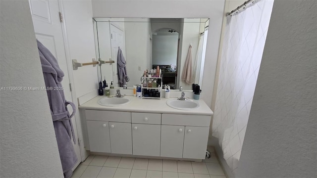 10846 SW 240th Ln, Homestead, FL 33032 - bathroom with double vanity, tile patterned flooring, and a textured wall