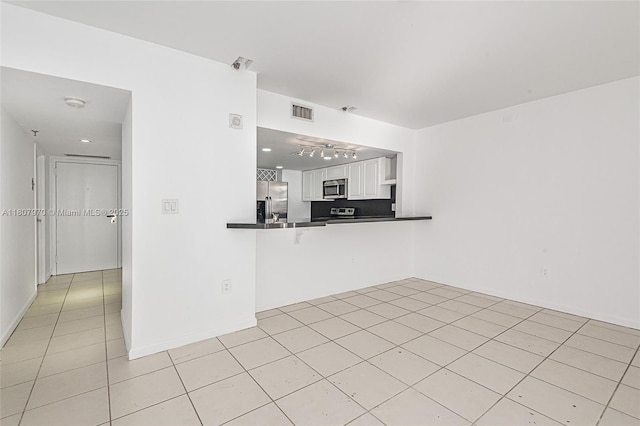 555 NE 15th St Unit 603, Miami, FL 33132 - unfurnished living room with light tile patterned floors