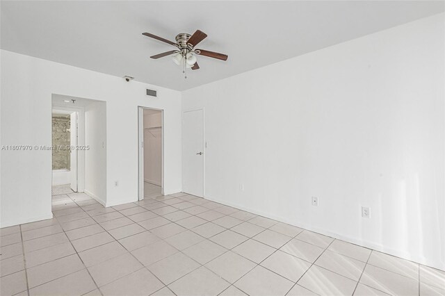 555 NE 15th St Unit 603, Miami, FL 33132 - empty room with ceiling fan and light tile patterned floors