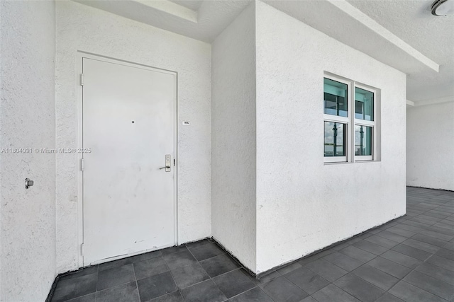 14951 Royal Oaks Ln Unit 1406, North Miami, FL 33181 - view of exterior entry with stucco siding
