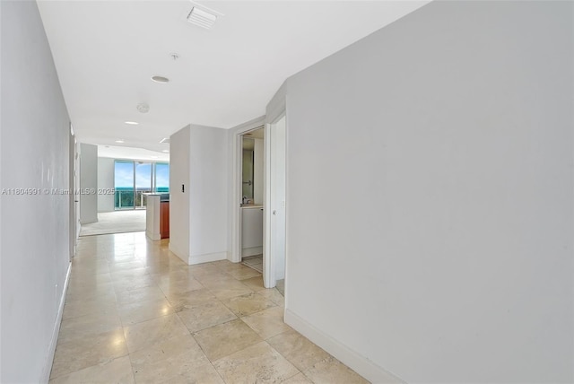 14951 Royal Oaks Ln Unit 1406, North Miami, FL 33181 - corridor with baseboards