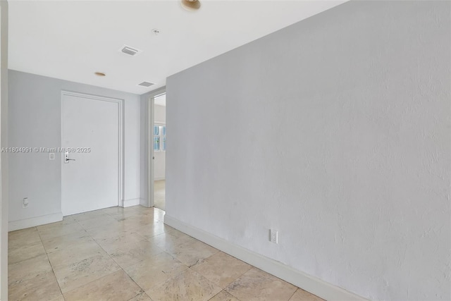 14951 Royal Oaks Ln Unit 1406, North Miami, FL 33181 - spare room featuring baseboards