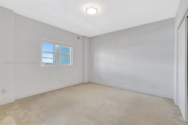 14951 Royal Oaks Ln Unit 1406, North Miami, FL 33181 - empty room featuring light colored carpet and baseboards