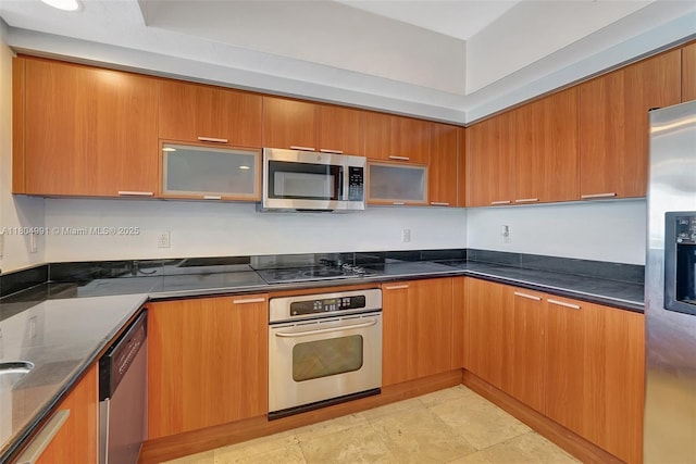 14951 Royal Oaks Ln Unit 1406, North Miami, FL 33181 - kitchen with appliances with stainless steel finishes, modern cabinets, and brown cabinets