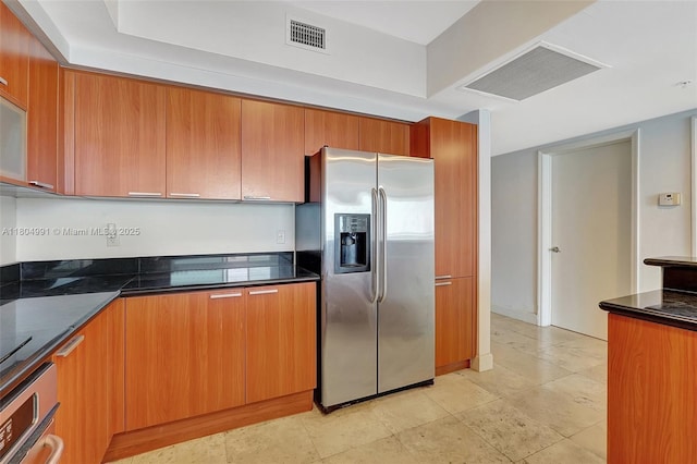 14951 Royal Oaks Ln Unit 1406, North Miami, FL 33181 - kitchen featuring appliances with stainless steel finishes, brown cabinetry, modern cabinets, and dark stone counters