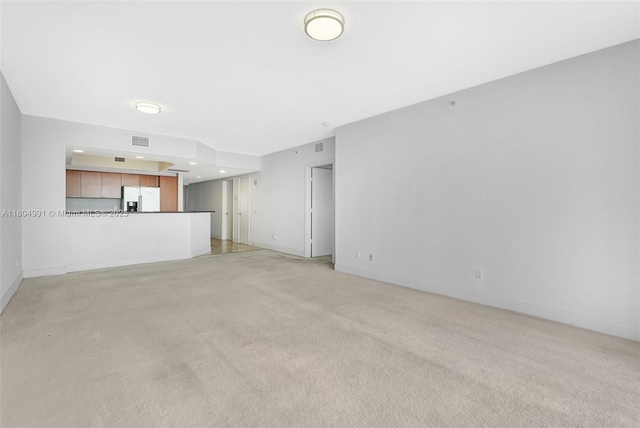 14951 Royal Oaks Ln Unit 1406, North Miami, FL 33181 - unfurnished living room with light carpet, baseboards, and recessed lighting