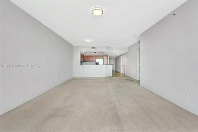 14951 Royal Oaks Ln Unit 1406, North Miami, FL 33181 - unfurnished living room with light carpet and baseboards
