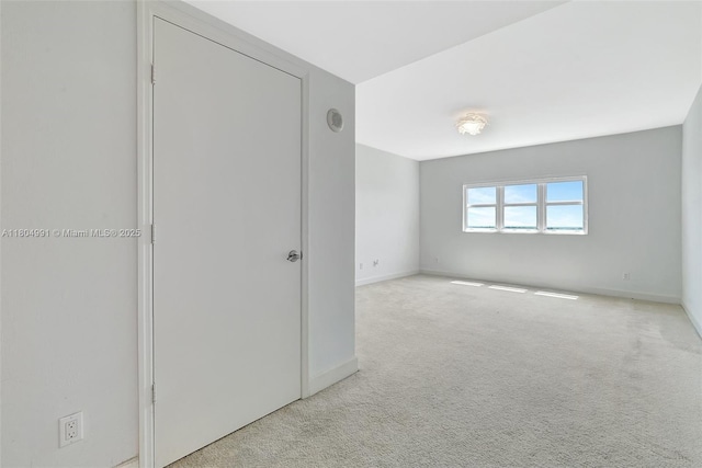 14951 Royal Oaks Ln Unit 1406, North Miami, FL 33181 - carpeted empty room featuring baseboards