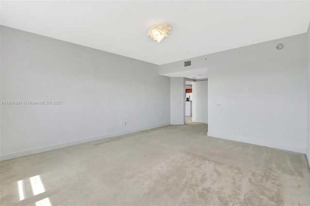 14951 Royal Oaks Ln Unit 1406, North Miami, FL 33181 - unfurnished room featuring light colored carpet and baseboards