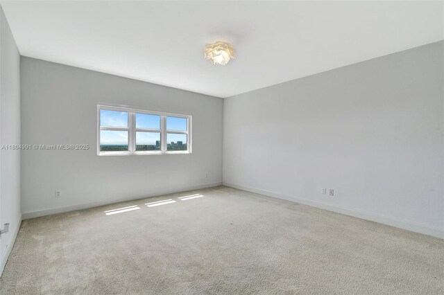14951 Royal Oaks Ln Unit 1406, North Miami, FL 33181 - unfurnished room featuring carpet flooring and baseboards