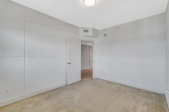 14951 Royal Oaks Ln Unit 1406, North Miami, FL 33181 - unfurnished room with light carpet and baseboards