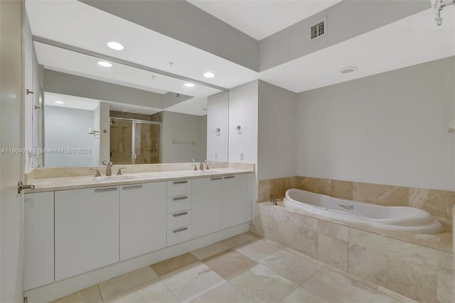 14951 Royal Oaks Ln Unit 1406, North Miami, FL 33181 - full bath with a garden tub, double vanity, a shower stall, recessed lighting, and tile patterned flooring