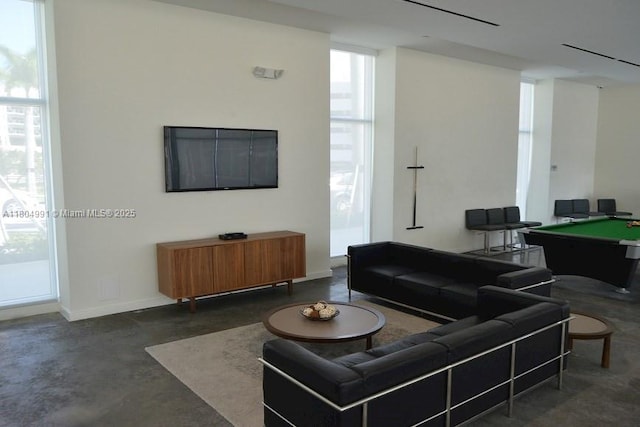 14951 Royal Oaks Ln Unit 1406, North Miami, FL 33181 - living room featuring concrete flooring and billiards table