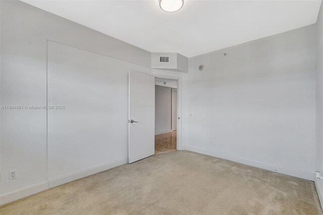 14951 Royal Oaks Ln Unit 1406, North Miami, FL 33181 - spare room with light carpet and baseboards