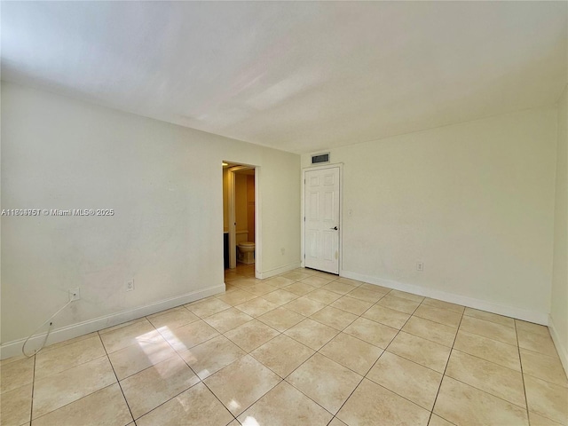 10825 SW 112th Ave Unit 302, Miami, FL 33176 - spare room with light tile patterned floors and baseboards