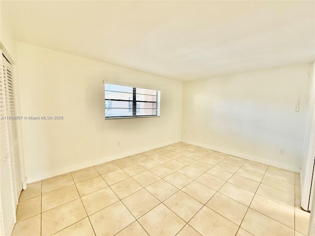 10825 SW 112th Ave Unit 302, Miami, FL 33176 - empty room with light tile patterned flooring