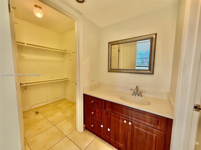 10825 SW 112th Ave Unit 302, Miami, FL 33176 - bathroom with vanity, a spacious closet, and tile patterned floors