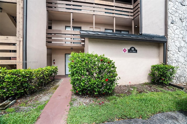 101 SW 96th Ter Unit 204, Plantation, FL 33324 - doorway to property featuring stucco siding and a balcony