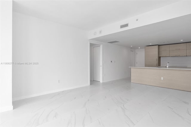1300 S Miami Ave Unit 3211, Miami, FL 33130 - unfurnished living room featuring light marble finish flooring and baseboards