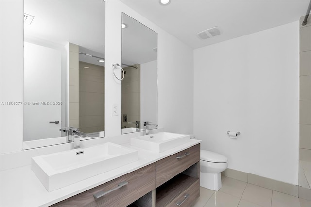1300 S Miami Ave Unit 3211, Miami, FL 33130 - bathroom featuring double vanity, tile patterned flooring, toilet, and recessed lighting