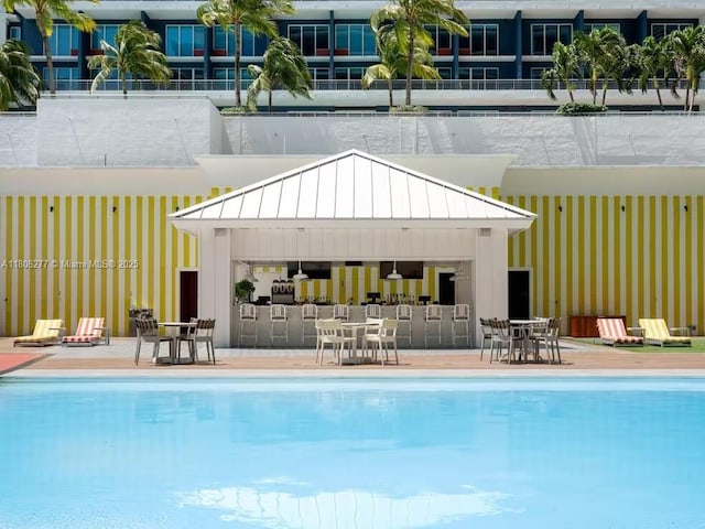 1300 S Miami Ave Unit 3211, Miami, FL 33130 - community pool featuring an outdoor structure, outdoor dining space, an exterior structure, and a patio