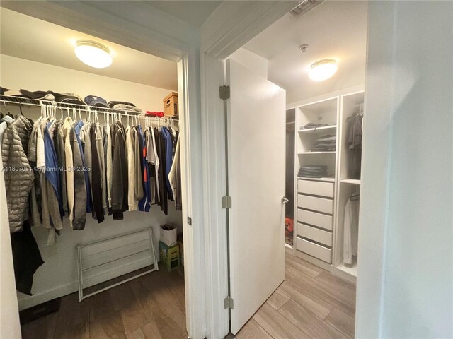 1600 SW 1st Ave Unit 910, Miami, FL 33129 - walk in closet featuring wood finished floors