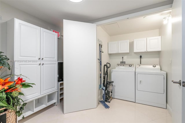 101 S Fort Lauderdale Beach Blvd Unit 1001, Fort Lauderdale, FL 33316 - laundry area featuring washer and clothes dryer, cabinet space, and light tile patterned flooring