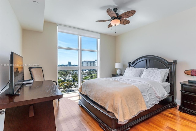 101 S Fort Lauderdale Beach Blvd Unit 1001, Fort Lauderdale, FL 33316 - bedroom with multiple windows, wood finished floors, and a view of city