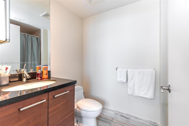 101 S Fort Lauderdale Beach Blvd Unit 1001, Fort Lauderdale, FL 33316 - full bathroom featuring toilet, vanity, wood finished floors, and curtained shower