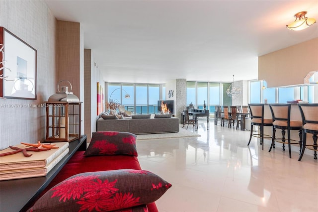 101 S Fort Lauderdale Beach Blvd Unit 1001, Fort Lauderdale, FL 33316 - living room featuring expansive windows and tile patterned floors