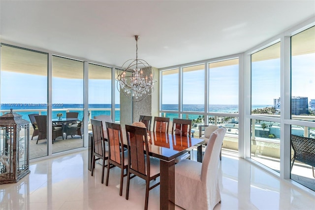 101 S Fort Lauderdale Beach Blvd Unit 1001, Fort Lauderdale, FL 33316 - dining area with a wall of windows, a chandelier, a water view, and light tile patterned flooring