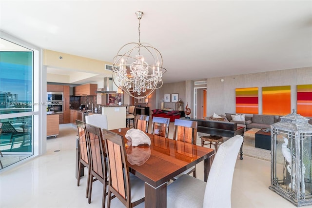 101 S Fort Lauderdale Beach Blvd Unit 1001, Fort Lauderdale, FL 33316 - dining space featuring wallpapered walls and a chandelier