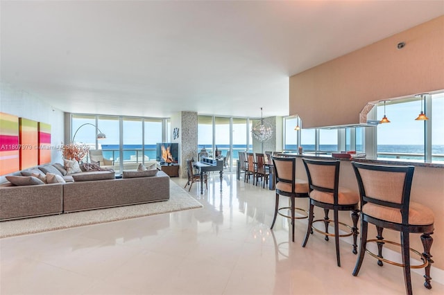 101 S Fort Lauderdale Beach Blvd Unit 1001, Fort Lauderdale, FL 33316 - living area with healthy amount of natural light, a wall of windows, and a water view