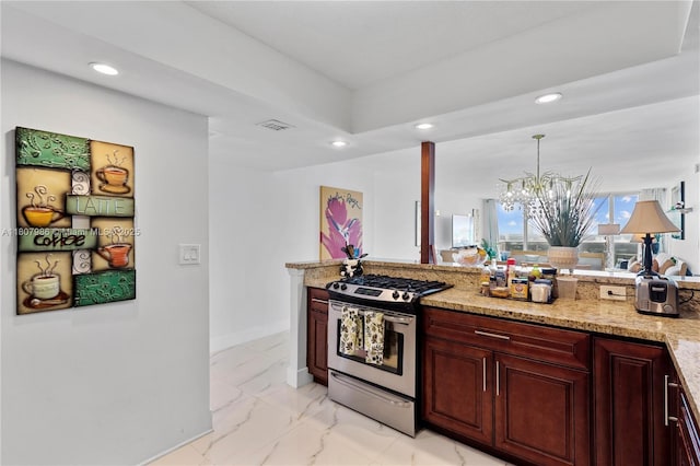 3140 S Ocean Dr Unit 2310, Hallandale Beach, FL 33009 - kitchen featuring gas range, recessed lighting, a chandelier, light stone countertops, and reddish brown cabinets