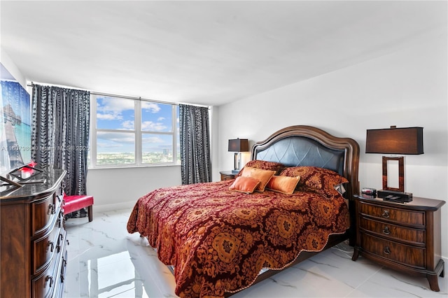 3140 S Ocean Dr Unit 2310, Hallandale Beach, FL 33009 - bedroom featuring light marble finish flooring and baseboards