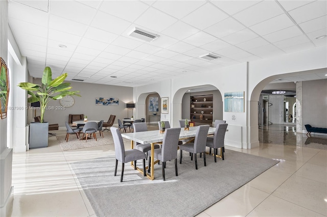 3140 S Ocean Dr Unit 2310, Hallandale Beach, FL 33009 - tiled dining space with arched walkways and a drop ceiling