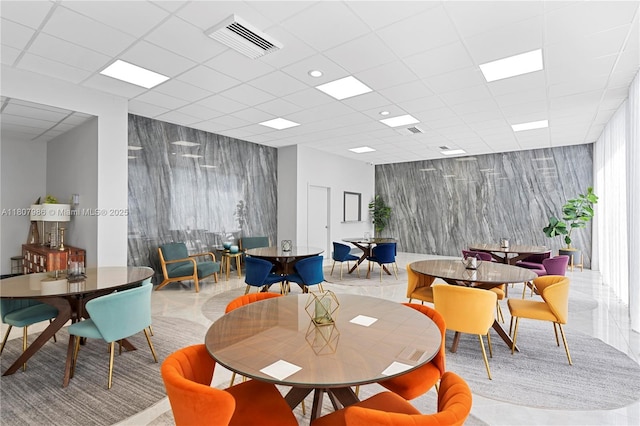 3140 S Ocean Dr Unit 2310, Hallandale Beach, FL 33009 - dining area featuring an accent wall and a paneled ceiling