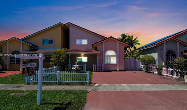 7891 SW 9th Ter, Miami, FL 33144 - mediterranean / spanish-style home featuring stucco siding, a tiled roof, and a gate