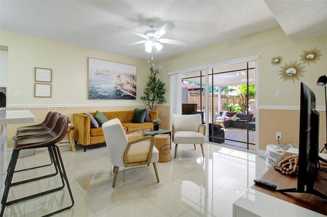 7891 SW 9th Ter, Miami, FL 33144 - living area with ceiling fan, light tile patterned flooring, and a textured ceiling